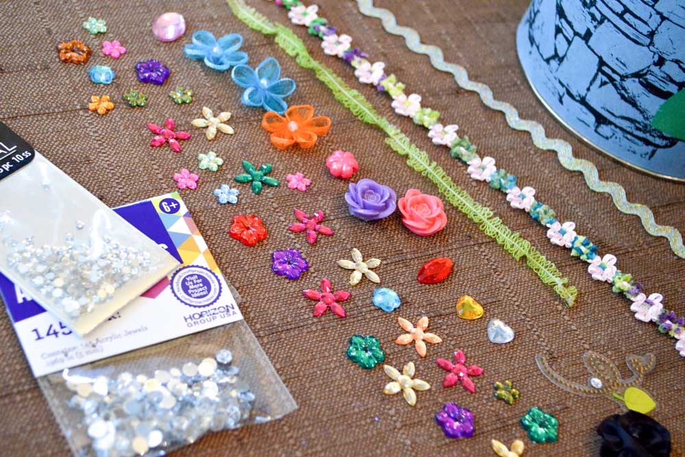Decorate your DIY princess tower with rhinestones and flowers