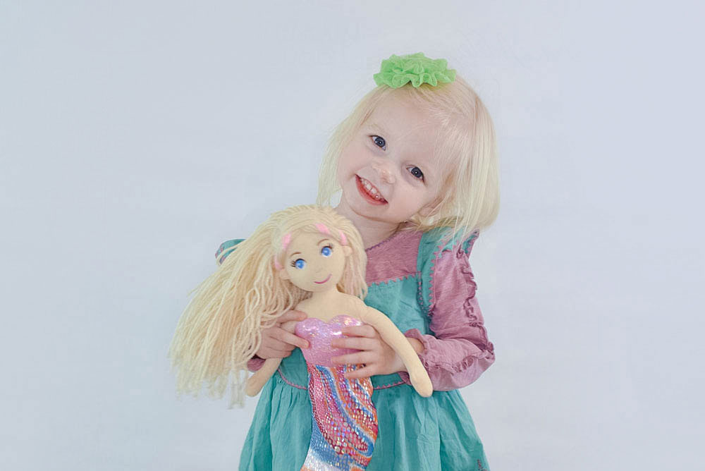 Little girl with mermaid doll and Matilda Jane dress - Mommy Scene