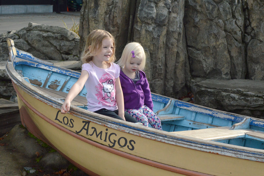 Family Day at the Seattle Woodland Park Zoo two girls in a boat - Mommy Scene
