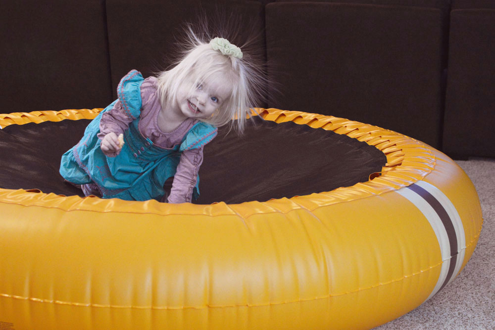 Toddler playing on The Shrunks trampoline pool - Mommy Scene review