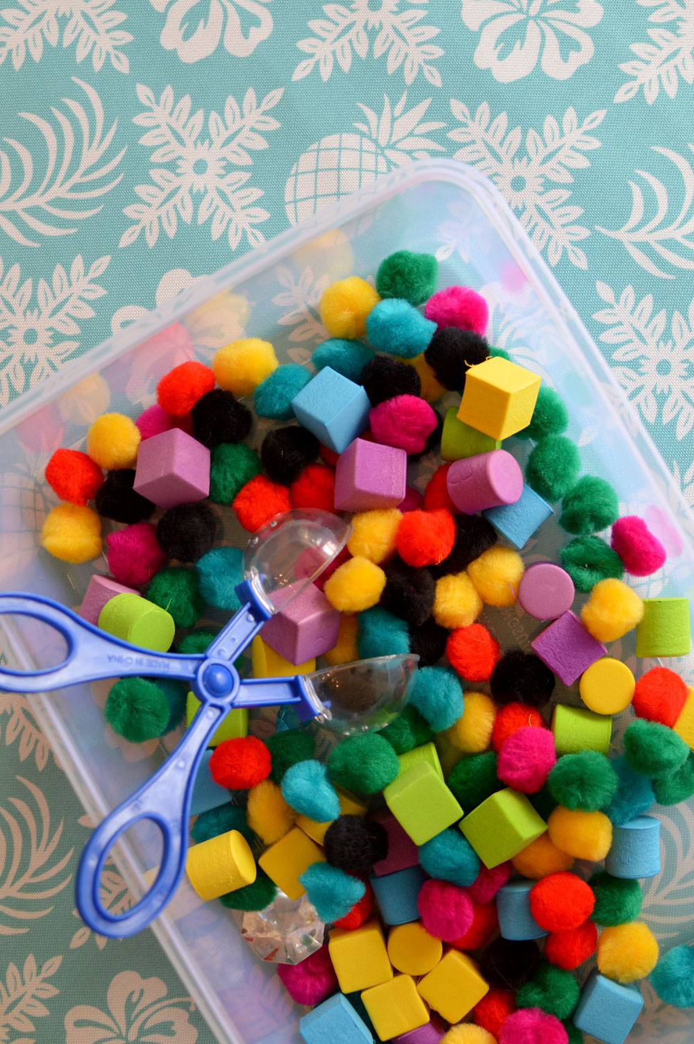 Playing with Pom Poms sensory toddler activity - Mommy Scene