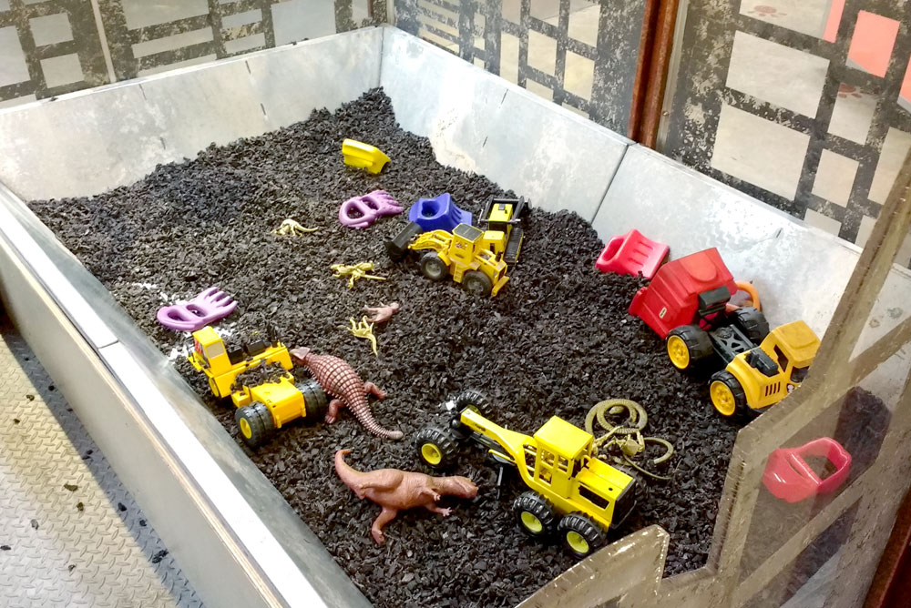 Mobius Spokane Children's Museum dinosaur and truck sensory box - Mommy Scene