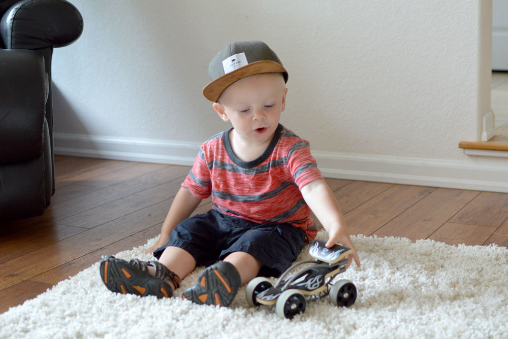 Baby boy with Hape toys e-Drifter