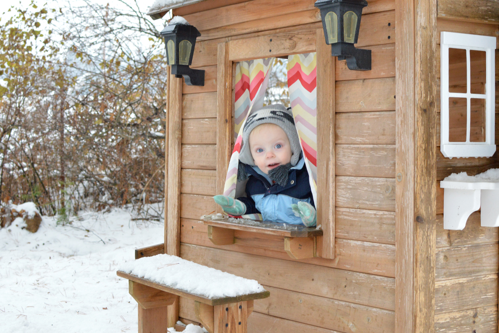 Baby boy playhouse in the snow - Mommy Scene