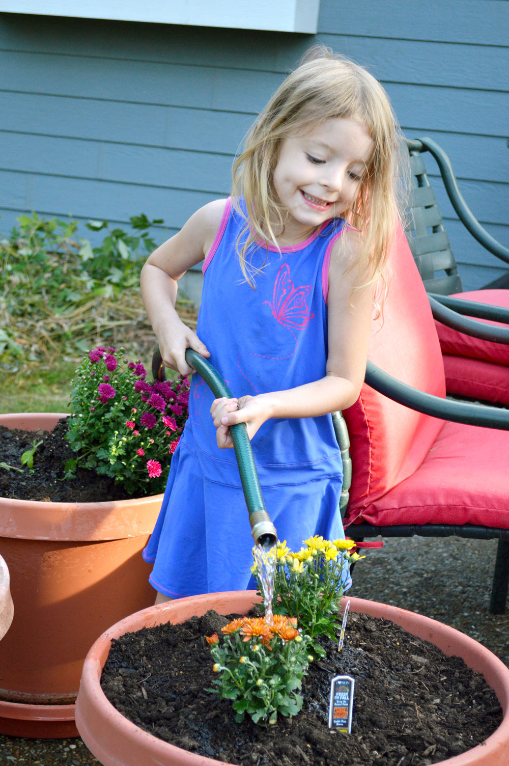 Planting for fall and watering kids activity - Mommy Scene