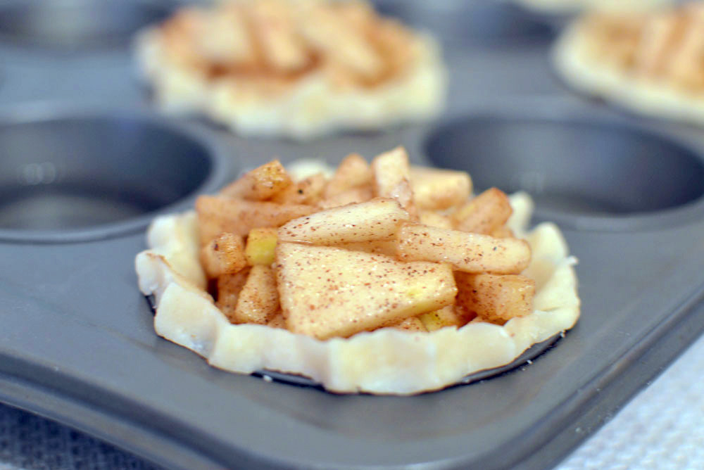 Bite-Sized Mini Apple Pies in a muffin tin - Mommy Scene
