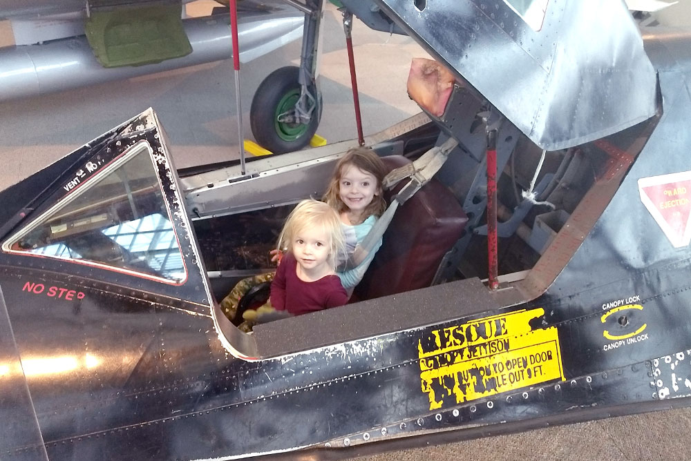Seattle Museum of Flight sitting in a fighter jet - Pacific Northwest family trip
