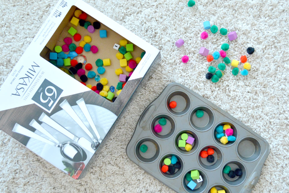 Toddler Homeschool Activities - Fill a Box with Pom Poms - Mommy Scene