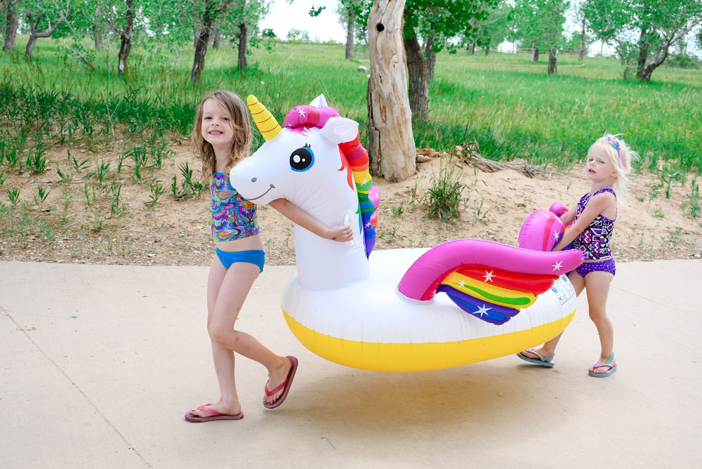 Taking a inflatable unicorn water toy to the lake