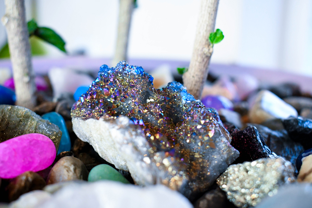 Spruce up your potted plants with a layer of gravel and polished gemstones