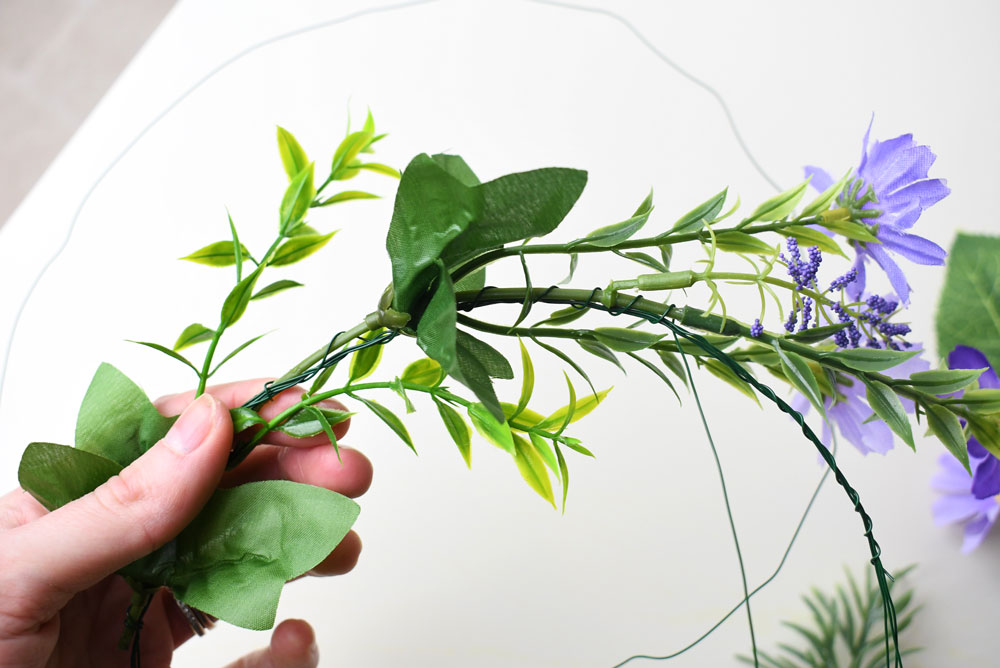 Design a DIY flower crown using wire and silk flowers