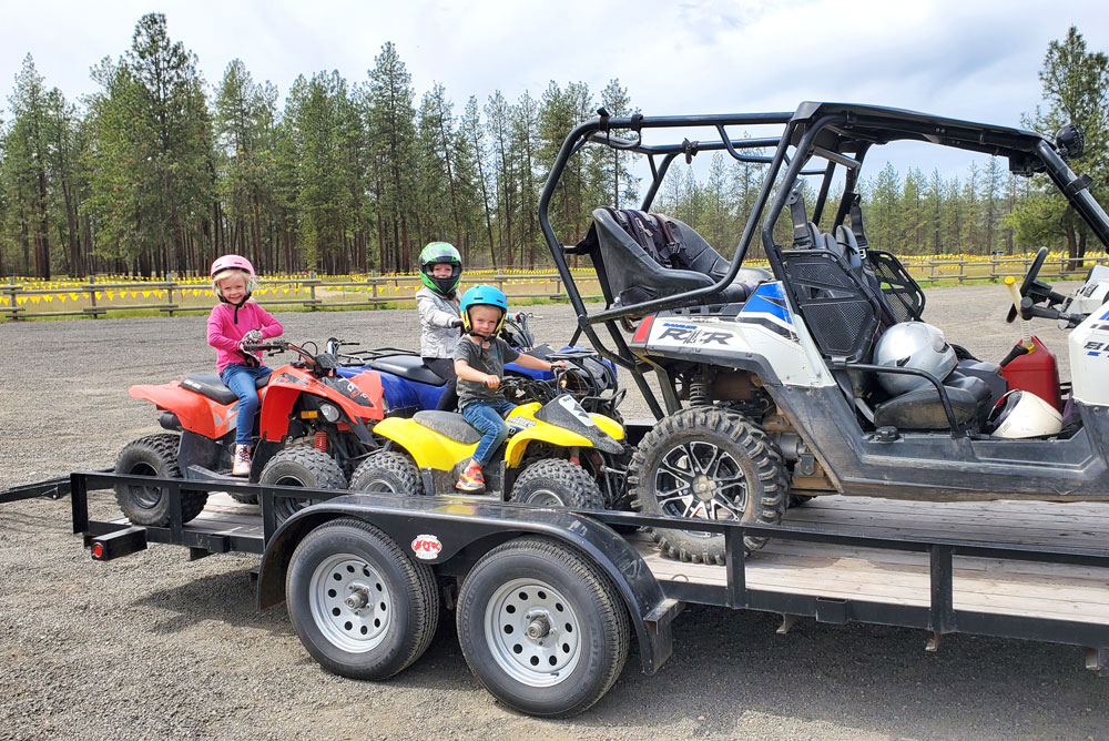 Unloading kids ATVs at the 7-Mile ORV Park near Spokane, Washington