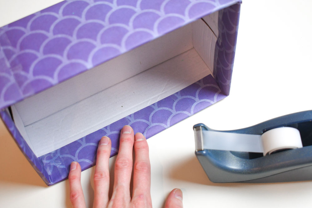 Cover a shoe box with printed paper to make a closet organizer