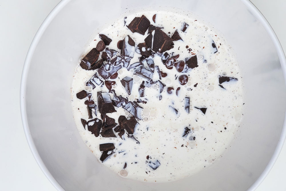 Mix chopped chocolate into heated heavy cream to make truffles
