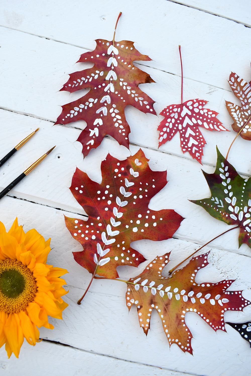 Painting real leaves with whimsical designs