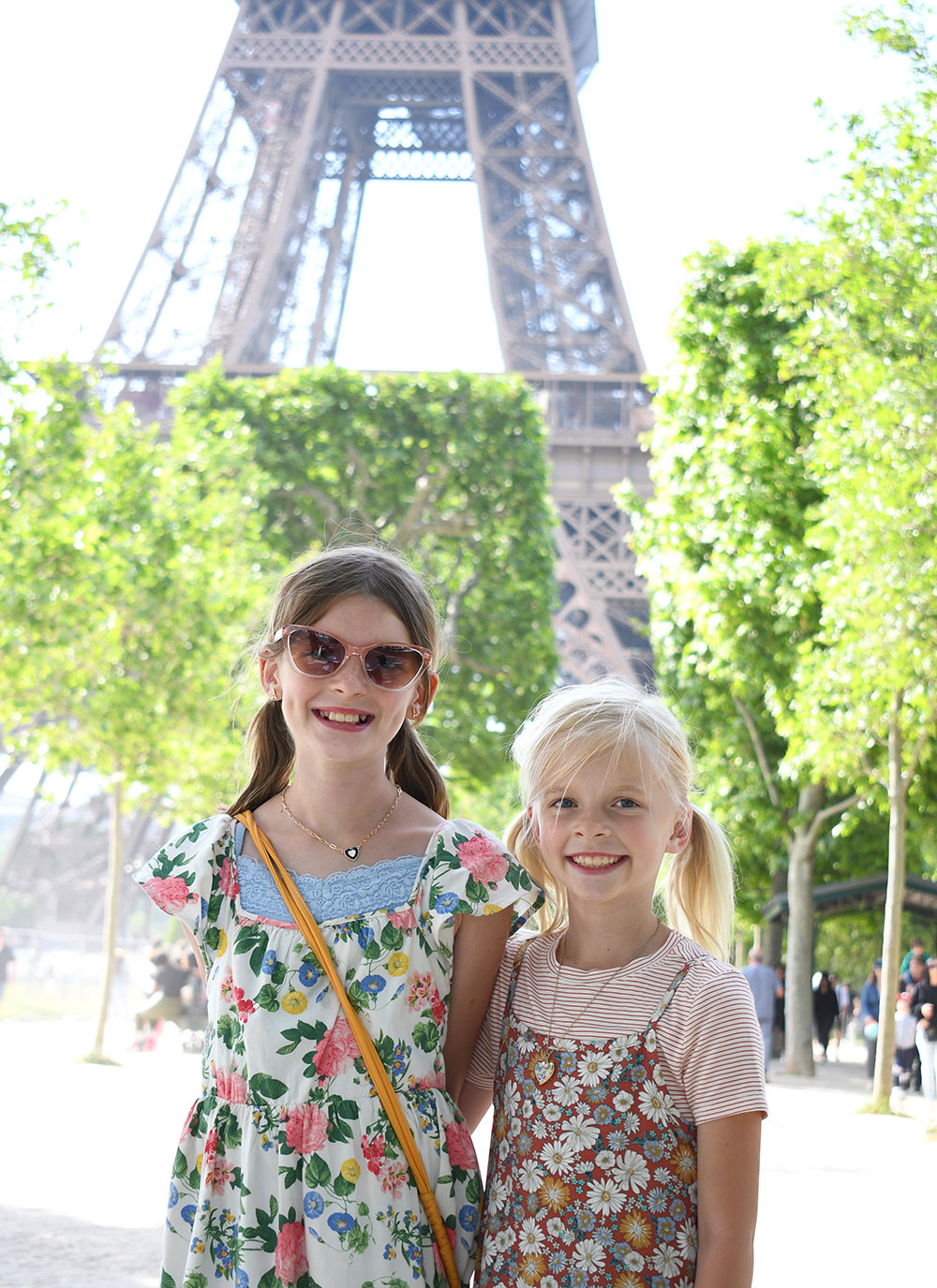 little girls in front of the Eiffel Tower