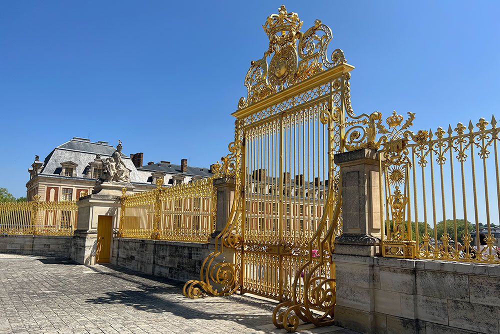 Palace of Versailles gold gate with metal spirals
