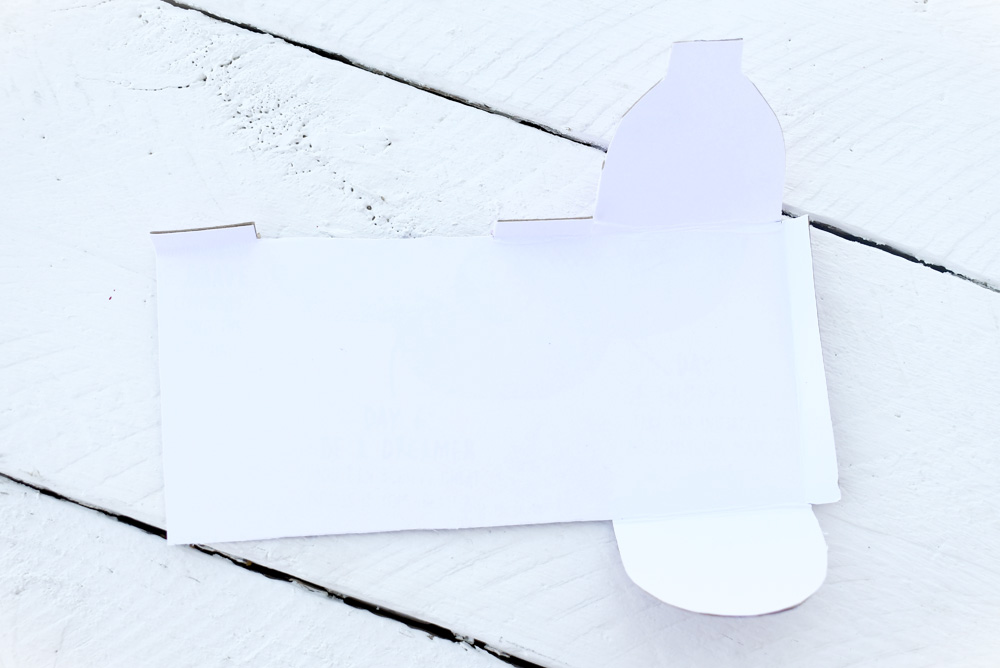 put the doll mailbox together using the tabs, rubber cement and hot glue
