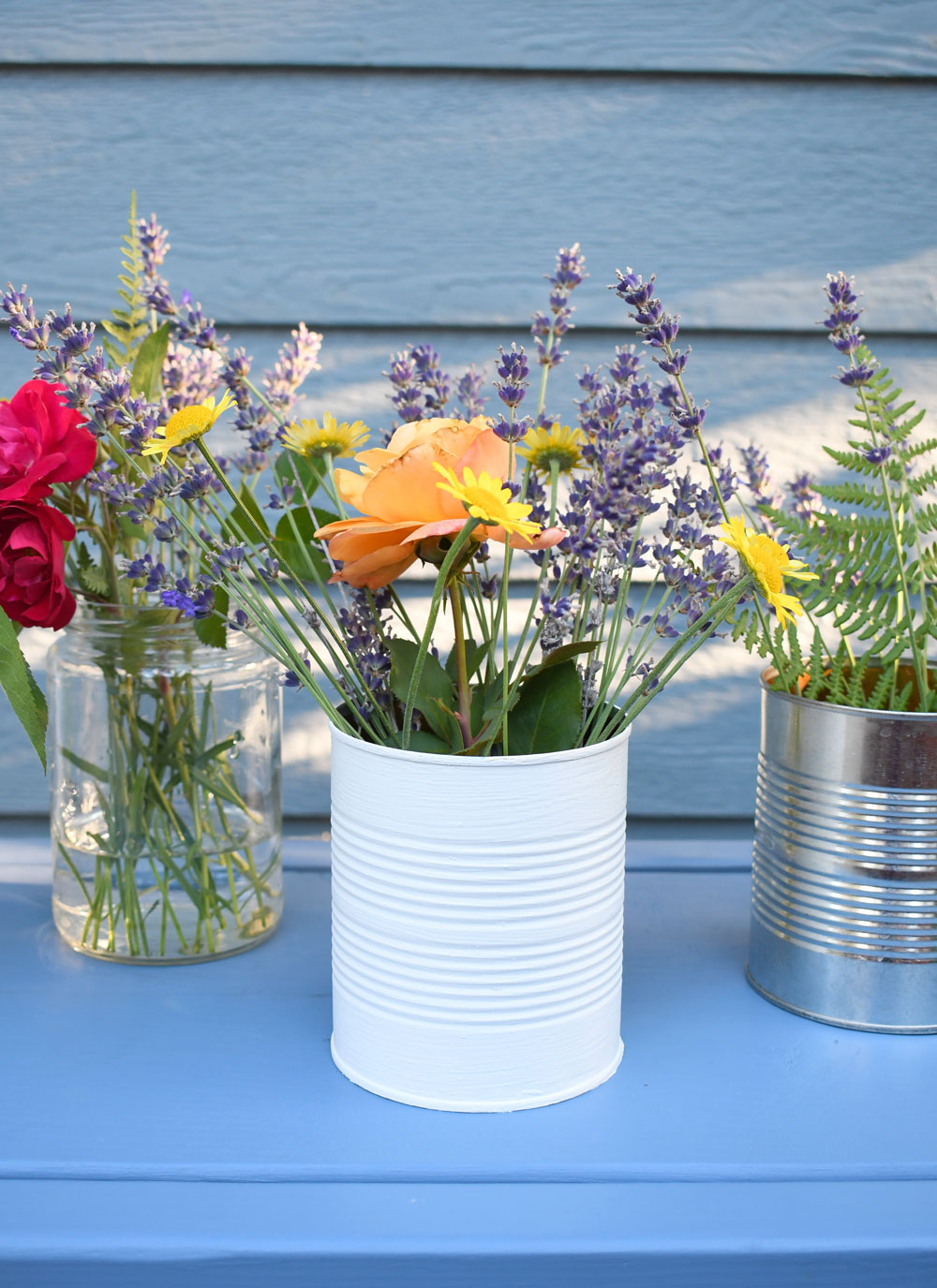 Make flower vases from recycled glass jars and tin cans