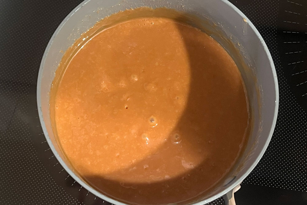 melt caramel candies to make dipped apples