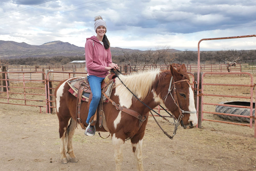 Family horseback riding in the desert near Tucson Arizona