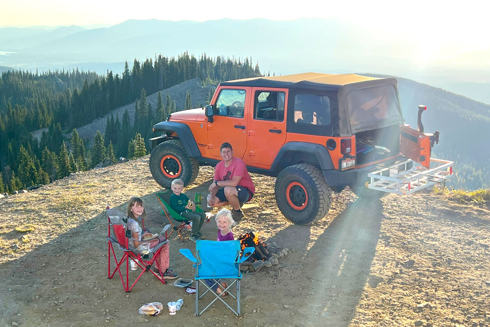 orange jeep and camp fire Lunch Peak lookout