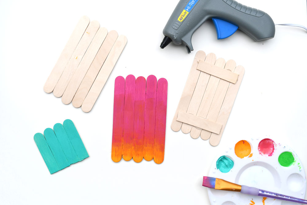 creative kids craft using popsicle sticks to make monsters