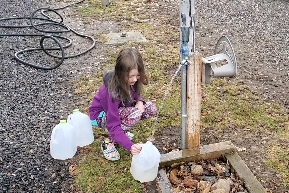 Filling up water jugs at a RV camp site in Oregon