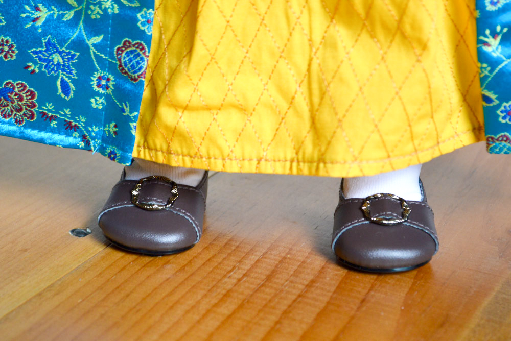 American Girl Felicity has simple brown buckle shoes