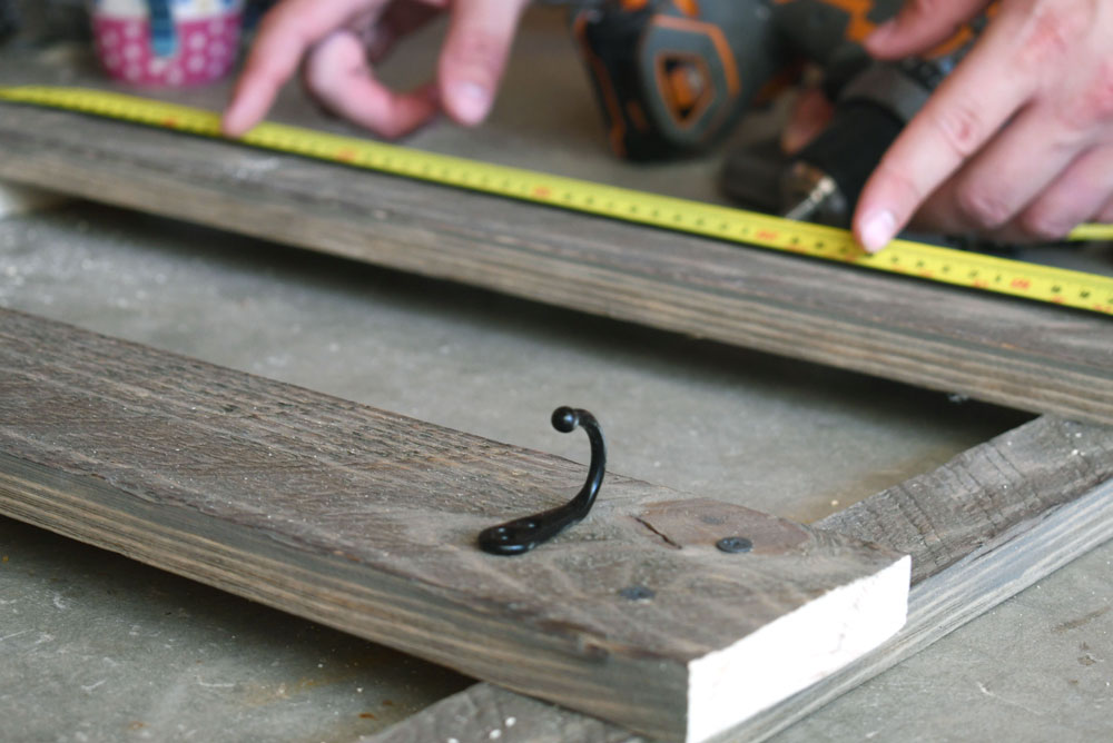 wood cup rack with black hooks