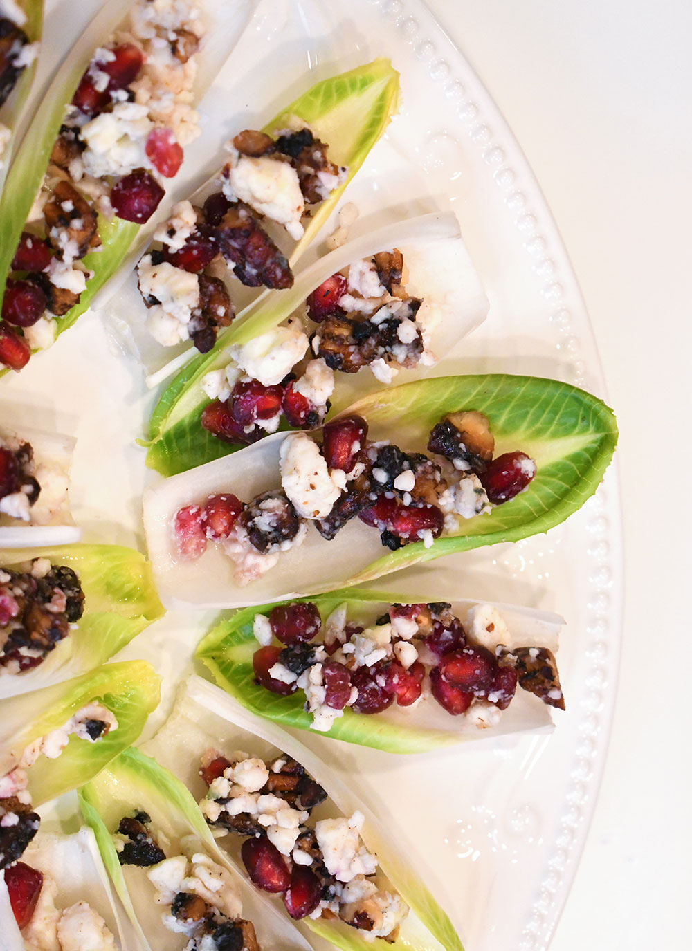 endive appetizers with blue cheese and pomegranate