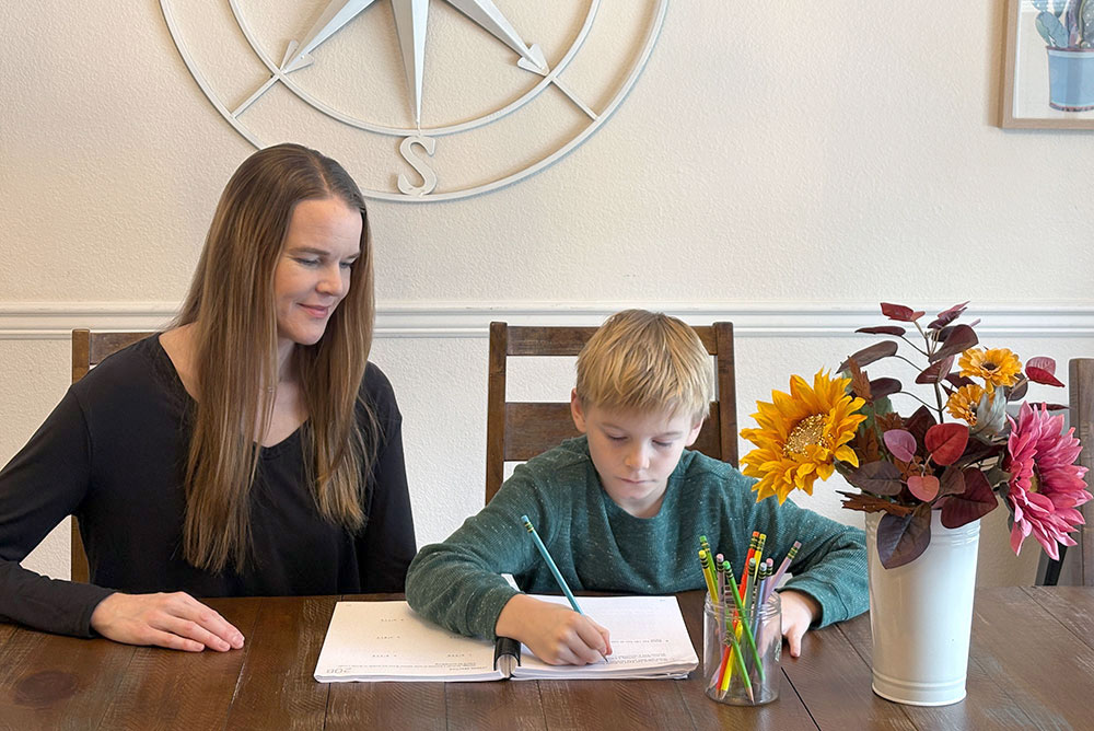 mom and student homeschool morning with workbooks