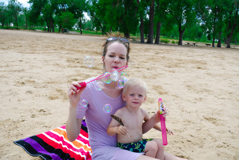 blowing bubbles fun summer activity for toddlers